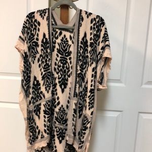 Kimono. Size S but oversized. Black and cream colored. Has cute black Pom pom